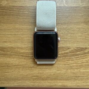 Rose gold Apple Watch 1 with Cream Band